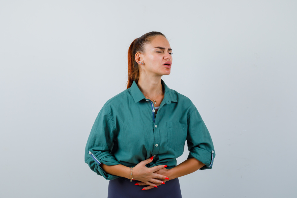young-lady-suffering-from-stomachache-green-shirt-looking-painful-front-view.jpg young-lady-suffering-from-stomachache-green-shirt-looking-painful-front-view.jpg