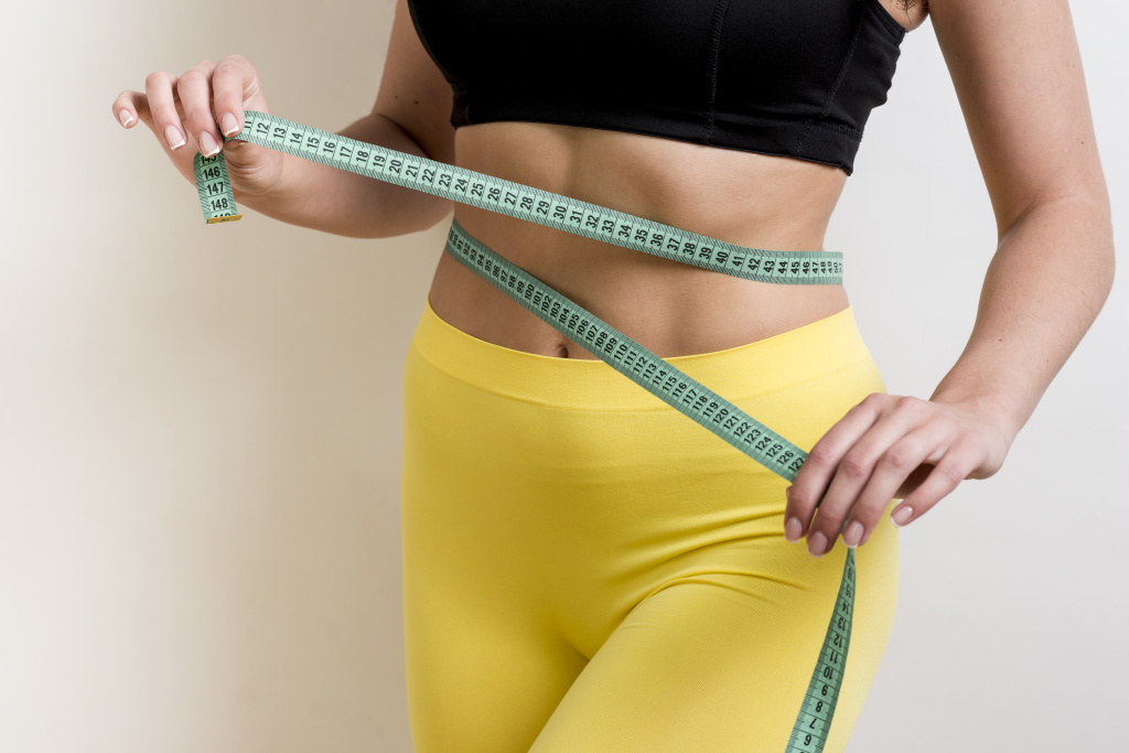 fitness-woman-with-measurement-tape (4).jpg